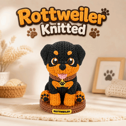 Gestrickte Rottweiler-Dekofigur auf rundem Sockel, schwarzes und orangefarbenes 3D-Garn.